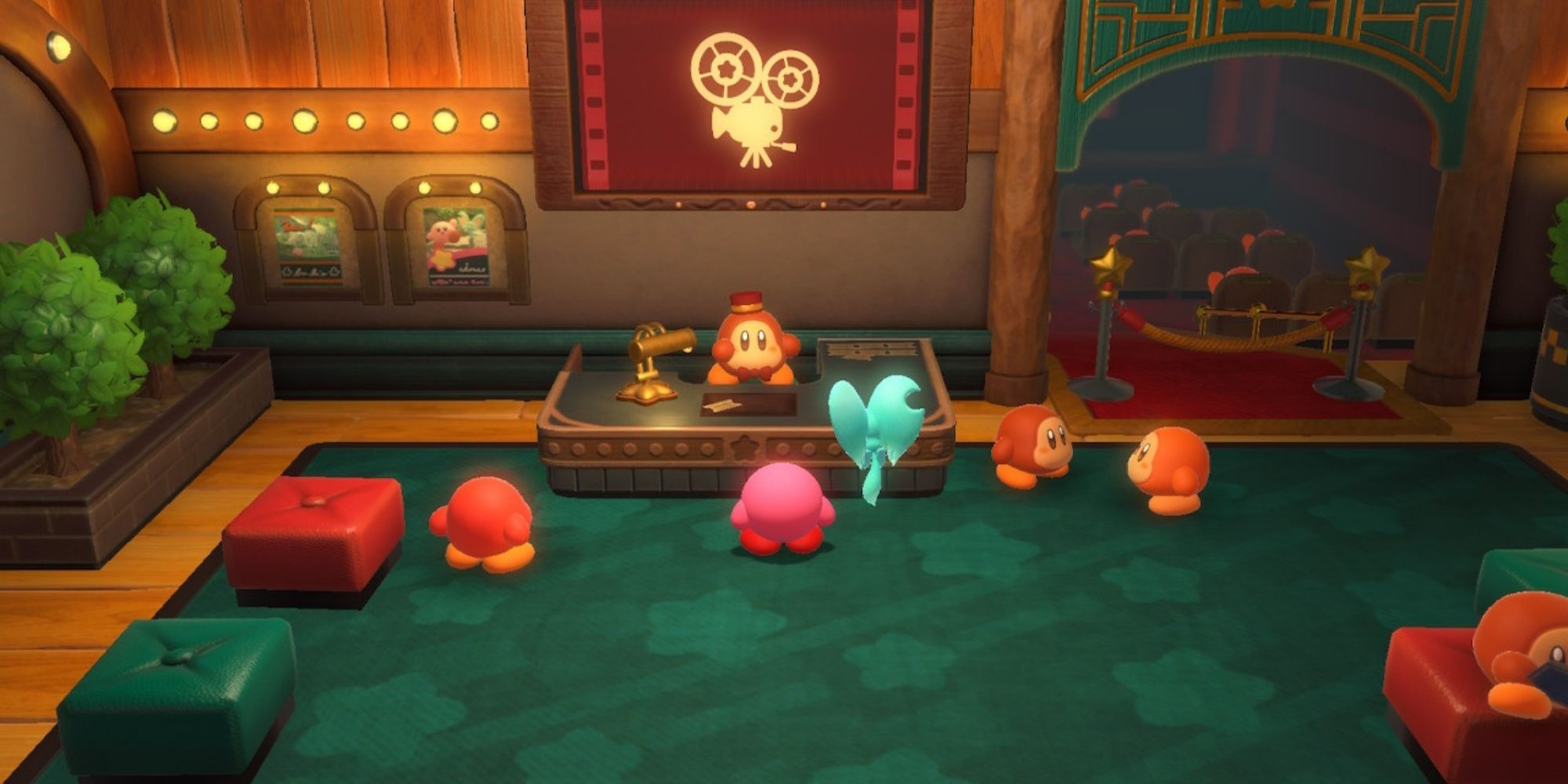 Kirby y la tierra olvidada Cine Waddle Dee Kirby y Elfilin junto al escritorio en el cine