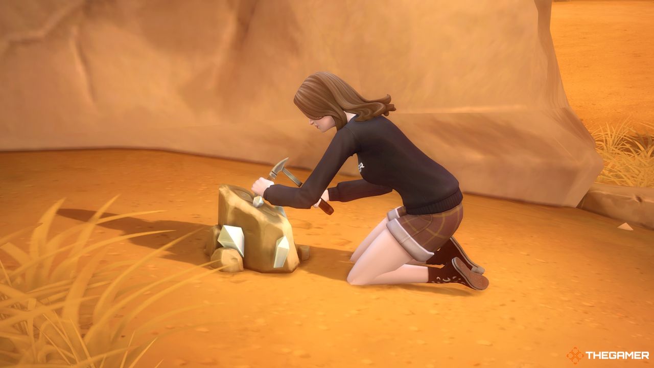 Un Sim excava una roca en Oasis Springs