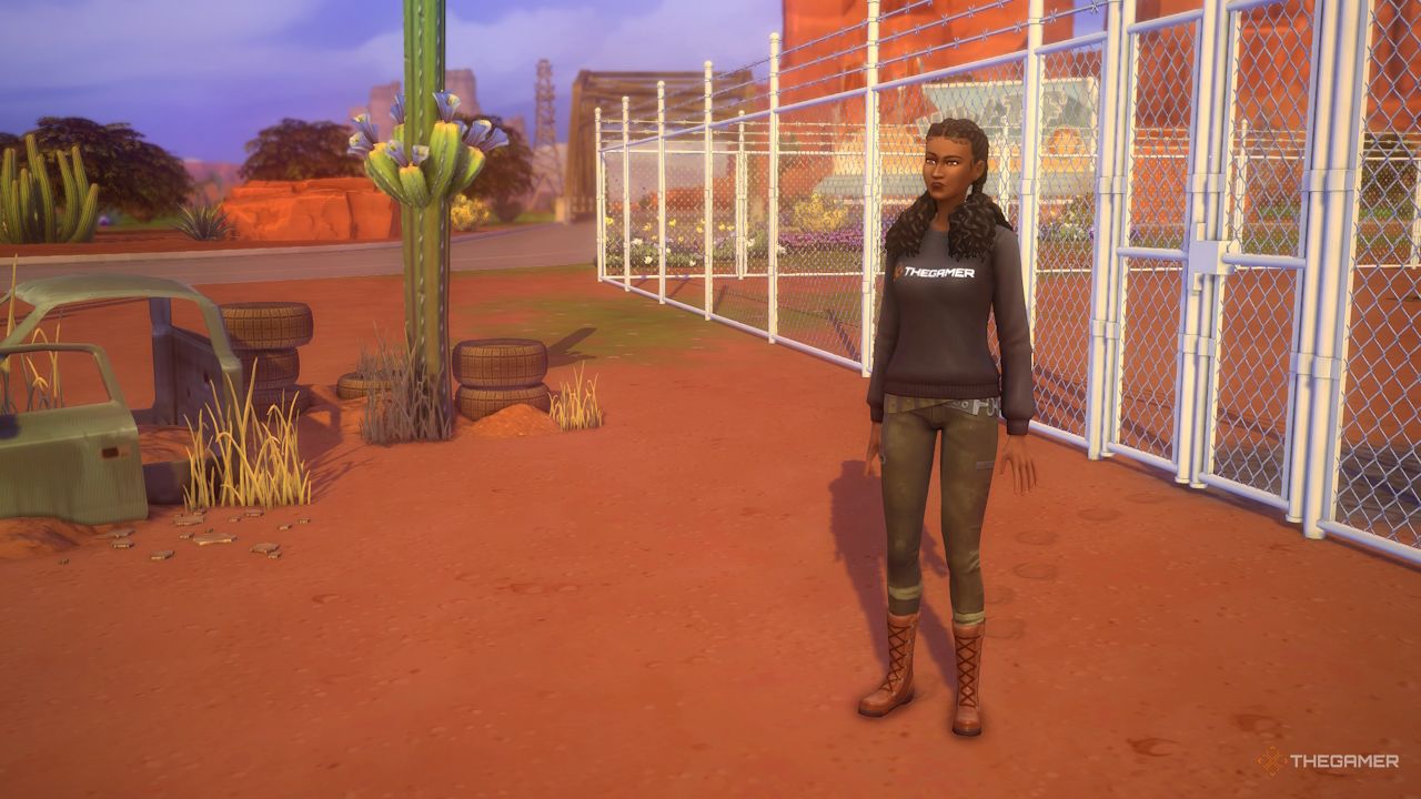 Un Sim se encuentra fuera de una valla en el desafío Zombie Aftermath.