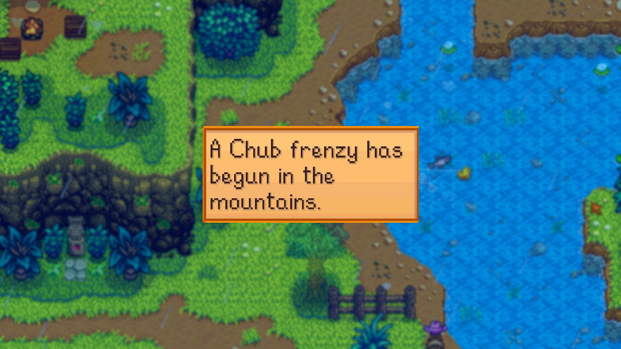 Una imagen de Stardew Valley de la notificación Fishing Frenzy.  Esta notificación en particular le dice al jugador que ha comenzado un Chub Frenzy en las montañas.