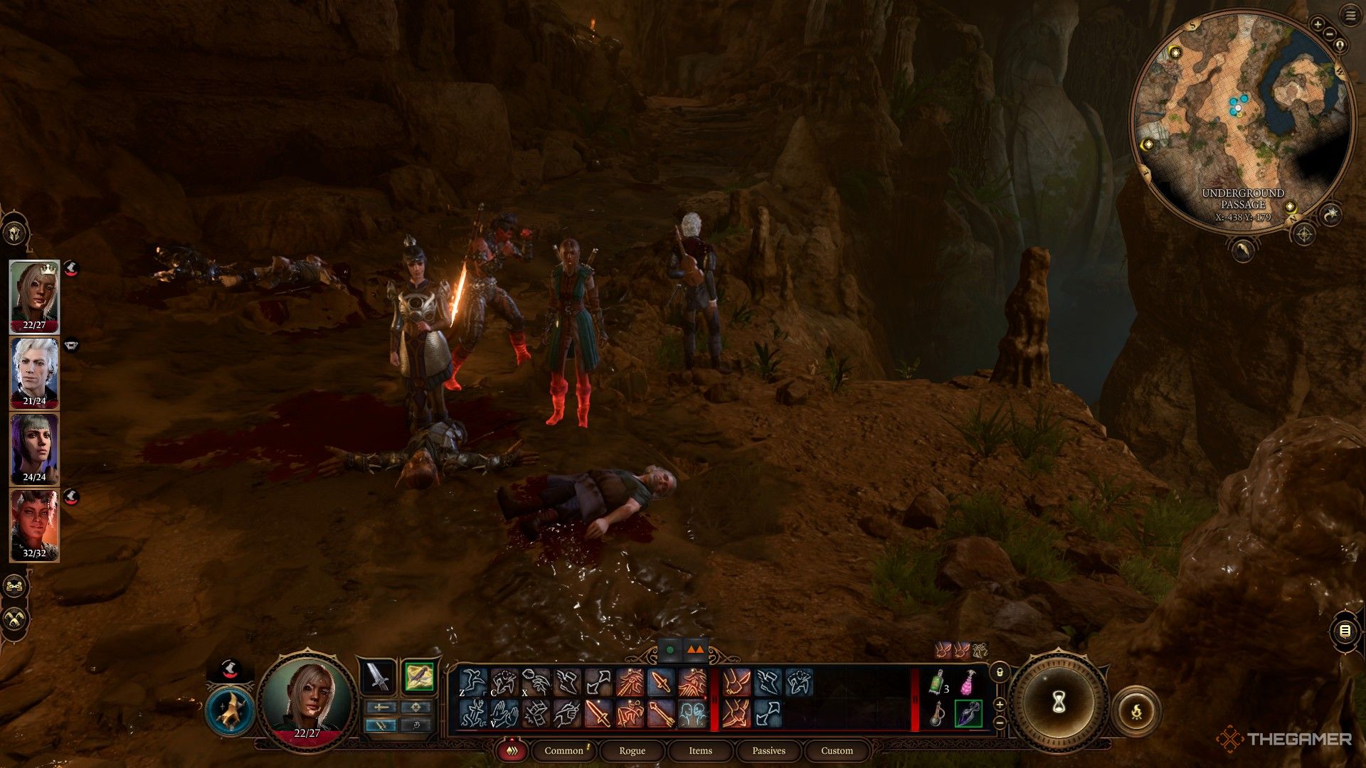 Tav y su equipo parados junto al inconsciente Findal en una cueva en Baldur's Gate 3.