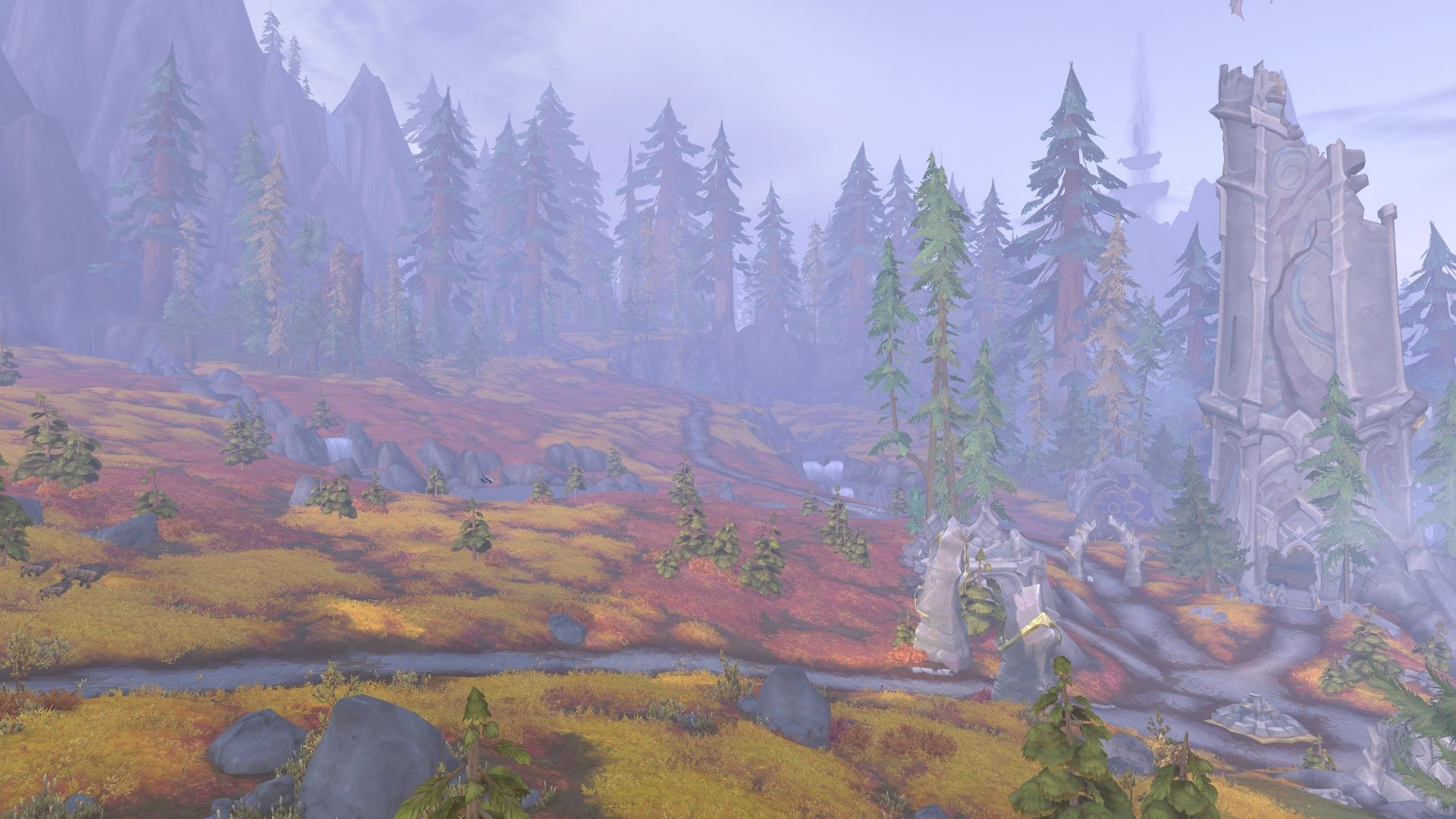 las estepas rojizas del tramo azul, con una torre dracónica en ruinas a la derecha, y los gigantescos bosques de pinos de la zona al fondo en World of Warcraft Dragonflight