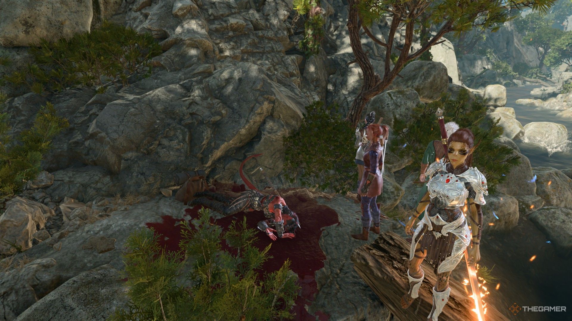 Karlach muerto en un montón de sangre rodeado por el grupo en Baldur's Gate 3.