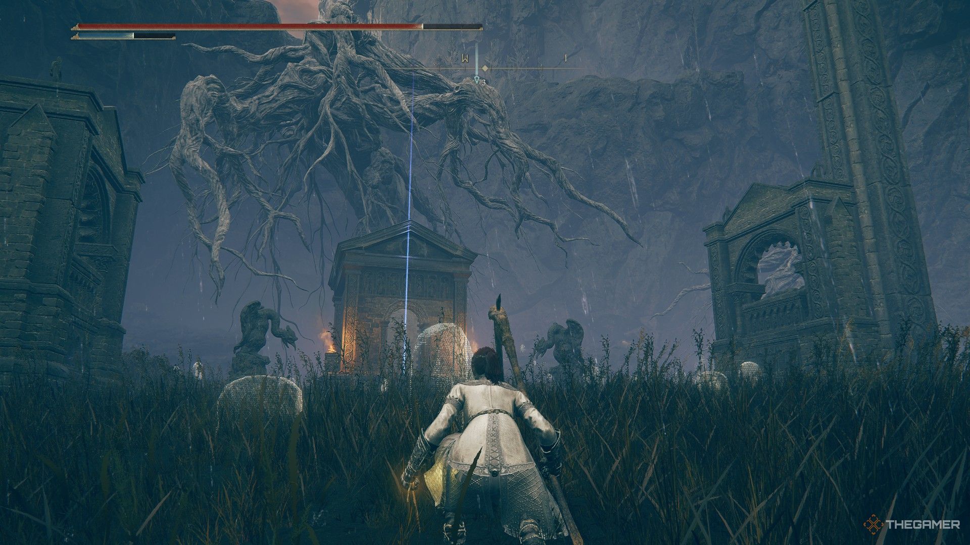 El jugador se agacha y contempla el mausoleo occidental sin nombre marcado por una baliza en Elden Ring: Shadow of the Erdtree.
