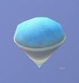 Imagen de ingrediente de cocina de Disney Dreamlight Valley que muestra la imagen del icono del granizado. Un cono de papel blanco contiene una porción redondeada y colmada de granizado dulce azul con un fondo azul.