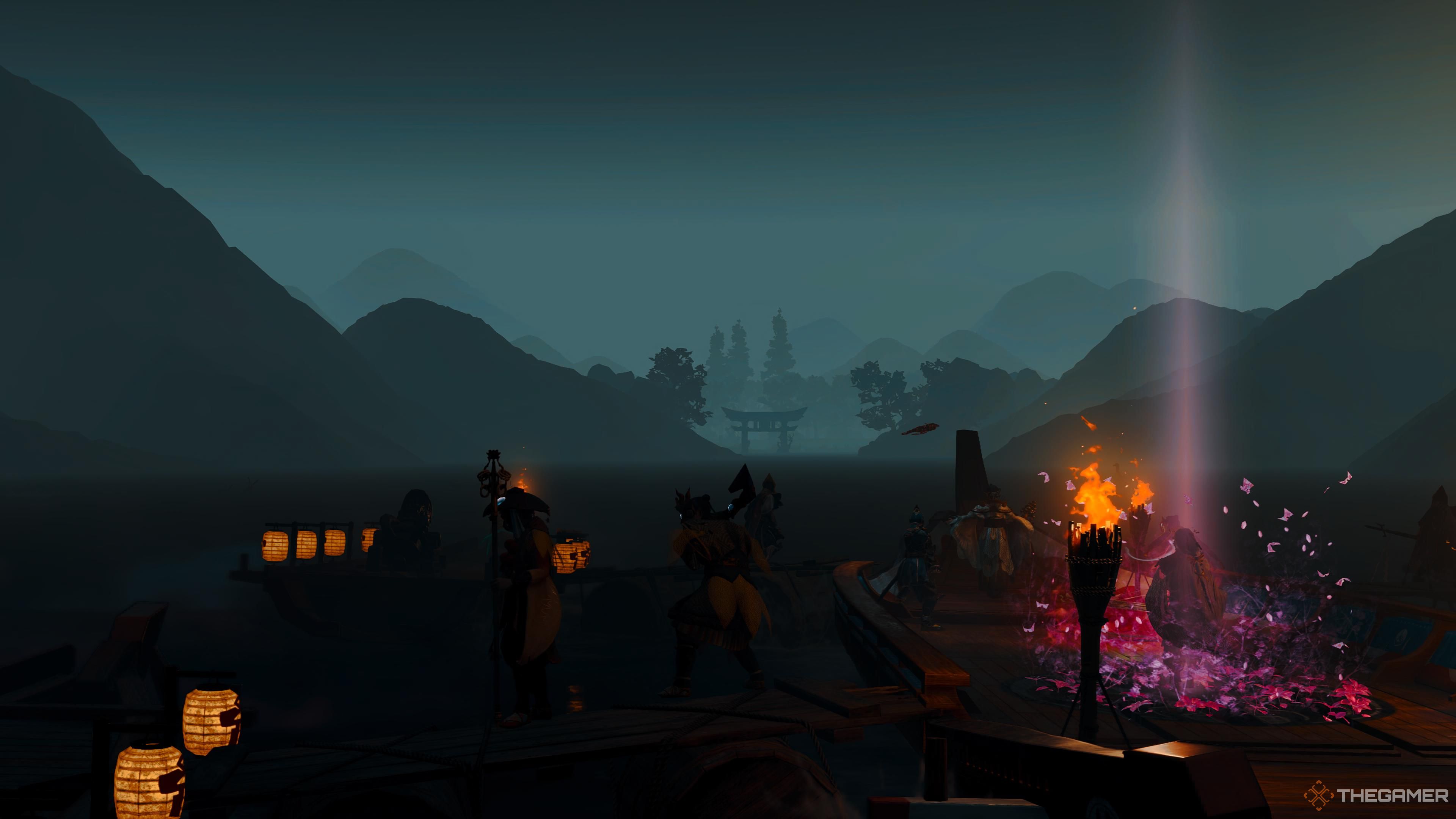 Los aldeanos miran la costa por la noche en Kunitsu-Gami: Path of the Goddess.