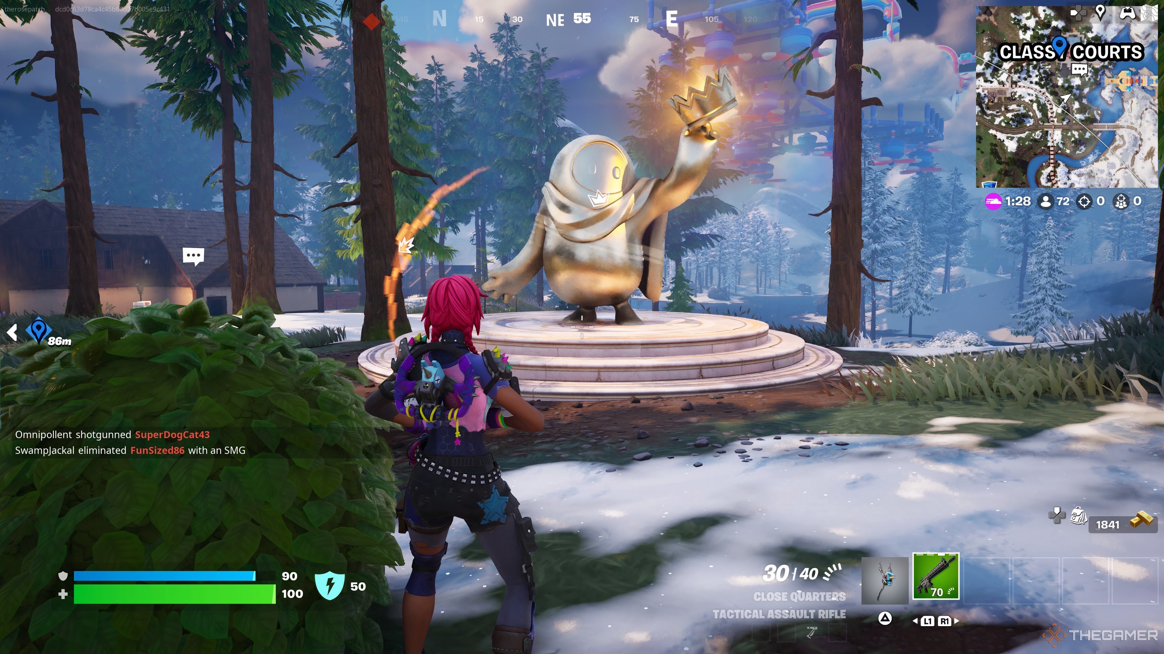 De pie frente a una estatua del ícono Bean de Fall Guys en Fortnite.