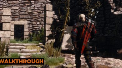 Geralt walks into a stone tower on a sunny day.