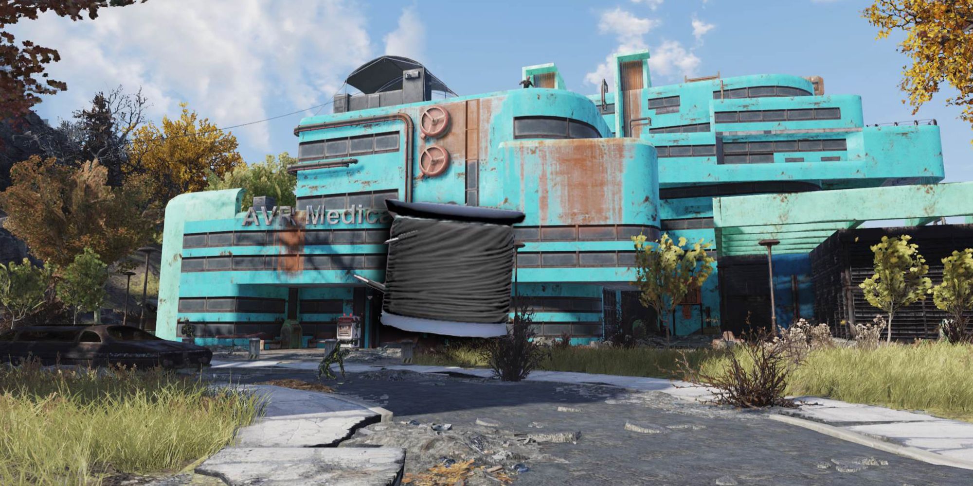 Fibra óptica de Fallout 76 superpuesta en una vista de un edificio médico