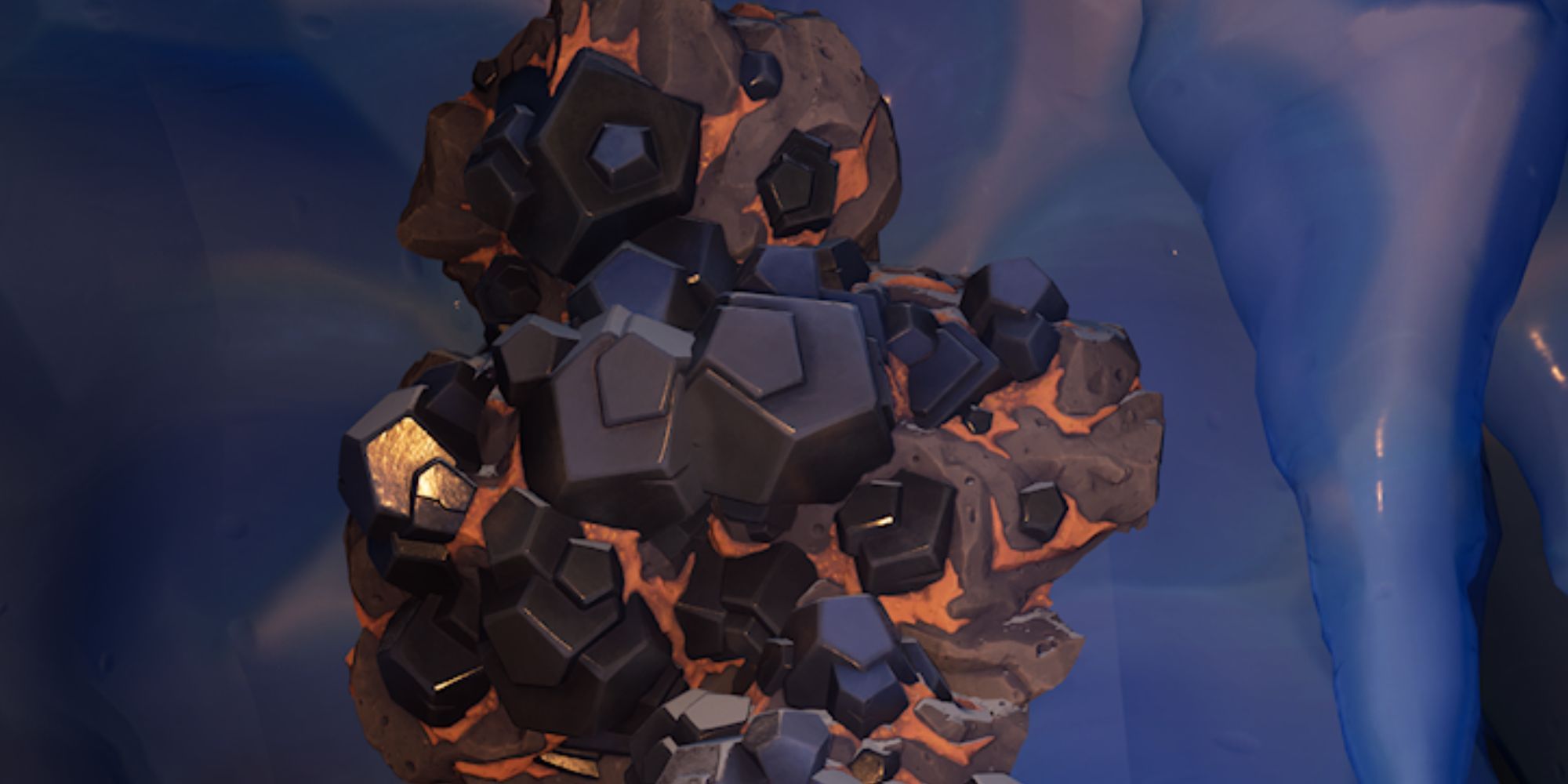 Un mineral de hierro en la pared de una cueva de hielo en Lego Fortnite.