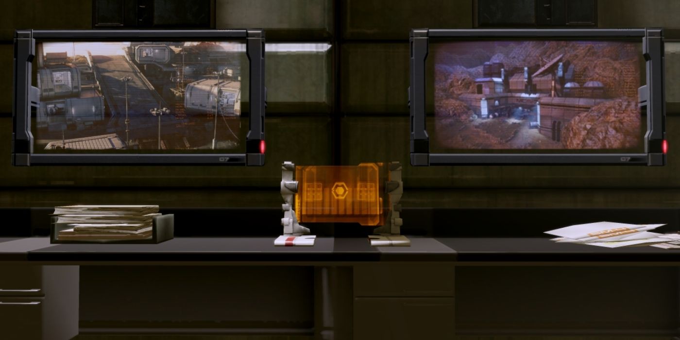 N7 Javelin Missiles Critical Decision Point: captura de pantalla de juego de Mass Effect que muestra dos monitores de computadora que muestran dos cámaras separadas de una ciudad poblada