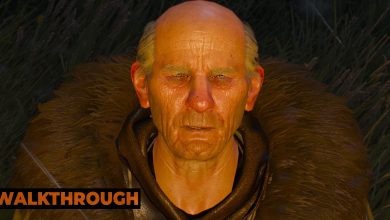 The Pellar looks at the camera, a red glow covering his face in the Witcher 3.