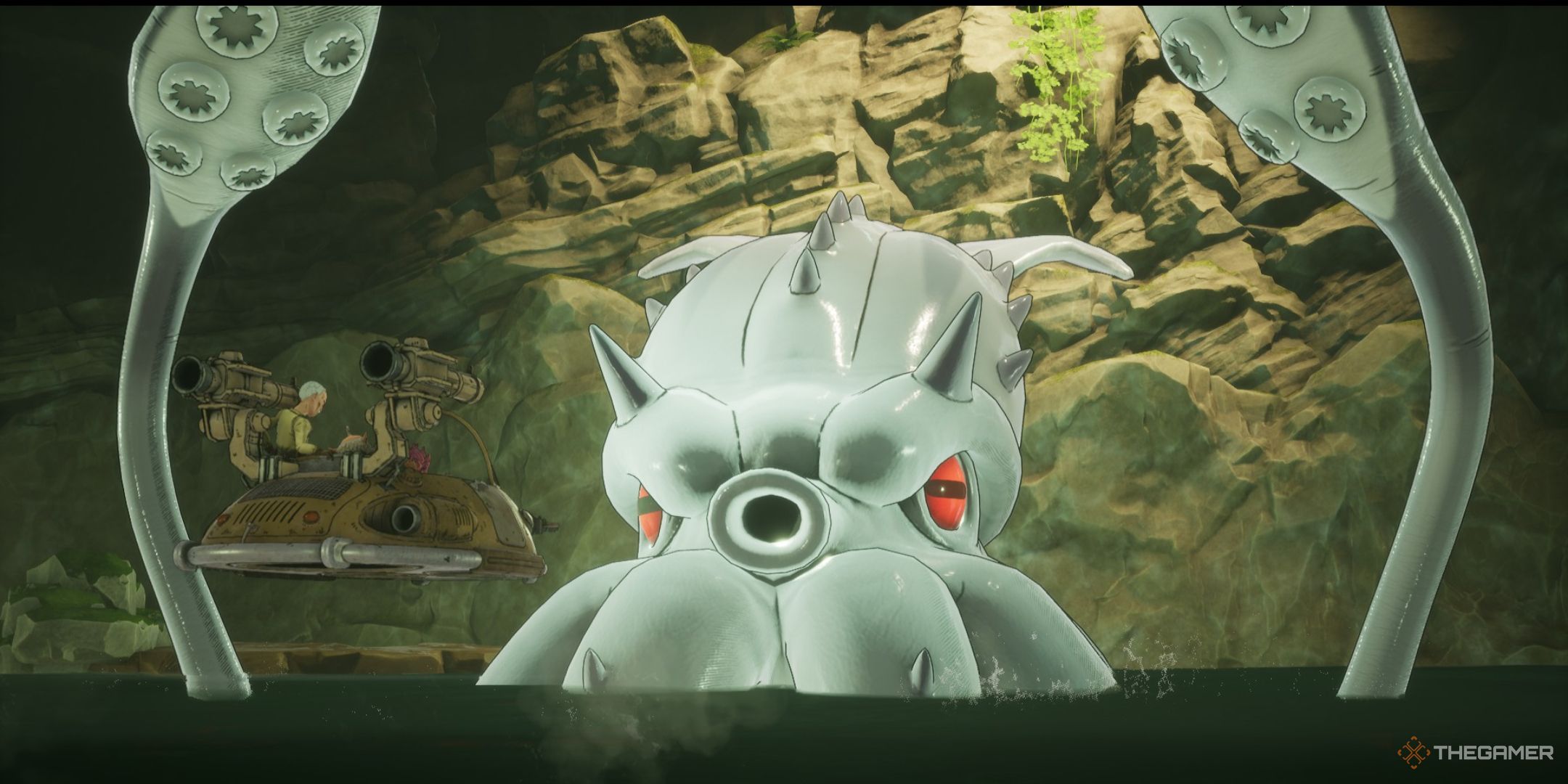 El kraken emerge de su caverna submarina en tierra de arena.
